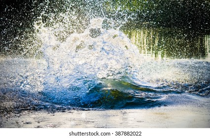 big water splash in lake after diving. Splash water on the river, beautiful colorful, bright splash - Powered by Shutterstock