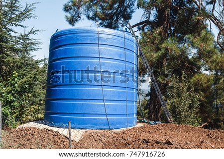Big water tank reservoir in garden