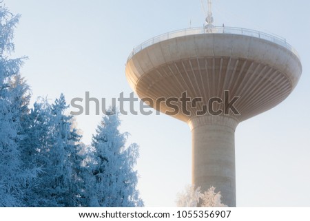 Big water tower in cold winter weather