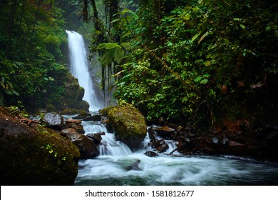 Big waterfall in tropical forest. La Paz Waterfall garden, beautiful tourist place in Costa Rica.