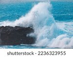 Big wave beating the rock . Cliff breaking the ocean wave . Power of nature 