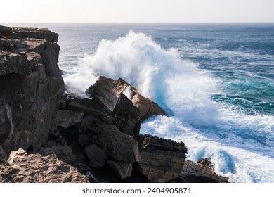 Big wave beating the rock, concept power of nature, cliff breaking the ocean wave on the beach La Pared on Fuerteventura. - Powered by Shutterstock