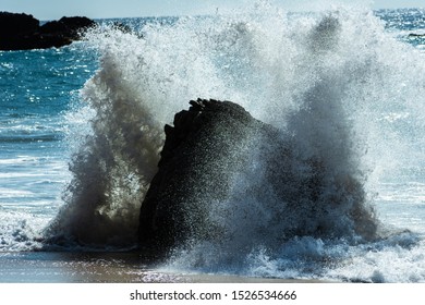 A Big Wave Hits A Rock