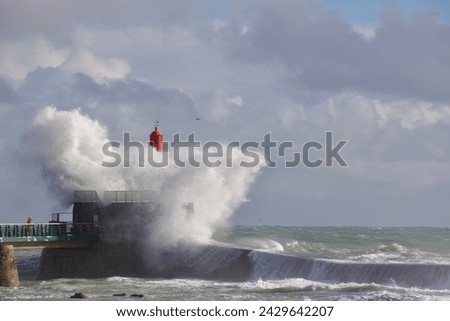 Big wave hitting the lighthouse of Les Sables d’Olonne