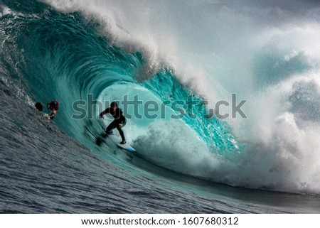 Big wave surfer in a perfect barrel at Shipstern Bluff, Tasmania