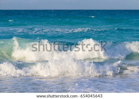 Big waves hitting the beach in the Caribbeans. Beautiful turquoise water of the ocean-stock photos