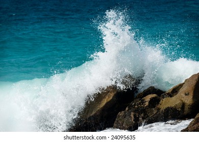 Big Waves Splashing Over Rocks