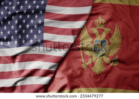 big waving colorful flag of united states of america and national flag of montenegro . macro