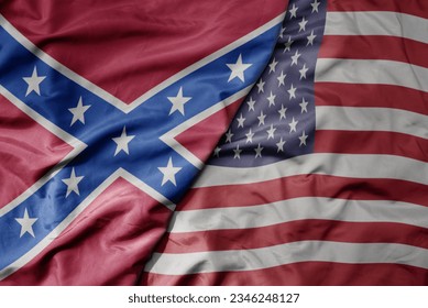 big waving colorful national flag of united states of america and confederate jack flag . macro