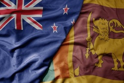 Big Waving National Colorful Flag Of Sri Lanka And National Flag Of New Zealand . Macro