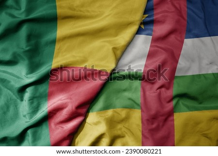 big waving national colorful flag of benin and national flag of central african republic . macro
