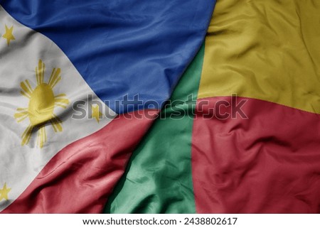 big waving national colorful flag of benin and national flag of philippines. macro