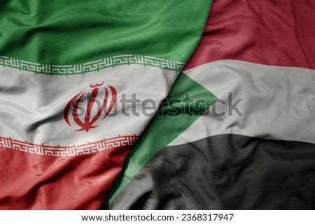 big waving realistic national colorful flag of iran and national flag of sudan . macro