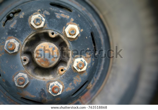 A big wheel flat tire of broken bus                     \
  