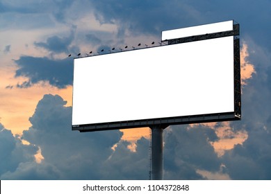 Big white billboard on the street in the sunset . Sky background. Copy space.