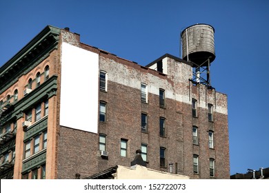 Big, White, Blank, Billboard On The Brick Building.