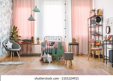 Big Window With Pink Curtains, Pompoms, Star And Cactus Pillows And A Metal Single Bed In A Sweet Bedroom Interior