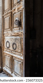 Big wooden entrance door of the Church of the Holy Sepulcher in the old city Jerusalem in Israel
 - Shutterstock ID 2360733255