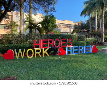 Big Yard Sign That Says Heroes Work Here In Front Of Hospital