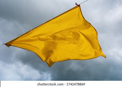 Big Yellow Bedsheet On A Rope.