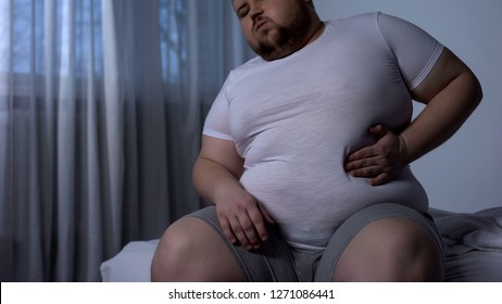 Big Young Man Suffering From Stomach Pain, Acid Reflux, Fat Liver Disease, Diet