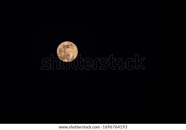 Biggest and brightest super moon of 2020 with space
for text