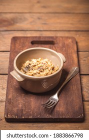 Bigos - Cabbage Stewed With Meat, Dried Mushrooms And Sausage On Old Wooden Background.Traditional Dish Of Polish Cuisine.