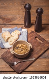 Bigos - Cabbage Stewed With Meat, Dried Mushrooms And Sausage On Old Wooden Background.Traditional Dish Of Polish Cuisine.