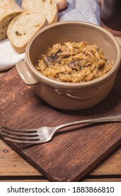 Bigos - Cabbage Stewed With Meat, Dried Mushrooms And Sausage On Old Wooden Background.Traditional Dish Of Polish Cuisine.