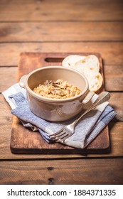 Bigos - Cabbage Stewed With Meat, Dried Mushrooms And Sausage On Old Wooden Background.Traditional Dish Of Polish Cuisine.