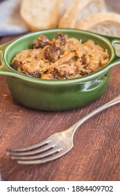 Bigos - Cabbage Stewed With Meat, Dried Mushrooms And Sausage On Old Wooden Background.Traditional Dish Of Polish Cuisine.