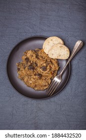 Bigos - Cabbage Stewed With Meat, Dried Mushrooms And Sausage On Old Wooden Background.Traditional Dish Of Polish Cuisine.