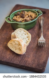 Bigos - Cabbage Stewed With Meat, Dried Mushrooms And Sausage On Old Wooden Background.Traditional Dish Of Polish Cuisine.