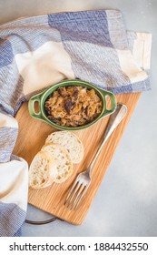 Bigos - Cabbage Stewed With Meat, Dried Mushrooms And Sausage On Old Wooden Background.Traditional Dish Of Polish Cuisine.