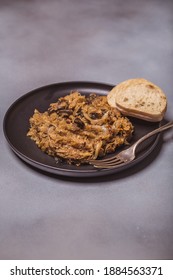 Bigos - Cabbage Stewed With Meat, Dried Mushrooms And Sausage On Old Wooden Background.Traditional Dish Of Polish Cuisine.