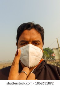 Bihar, India-11-07-2020; A Young Male Voter Showing His Inked Finger After Vote On The Road, During Amid Coronavirus Pendemic, Covid 19. Wearing Mask.