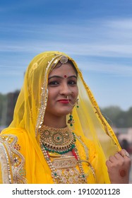 BIKANER, INDIA - JANUARY 12, 2020: Indian Rajasthani beautiful girl in national clothes poses for a photo during Camel Festival in Rajasthan. Beauty Pageant 2020 - Miss Marwan compitition.