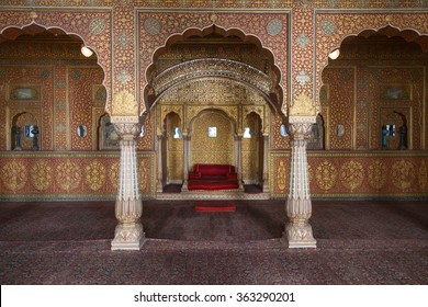 BIKANER, INDIA - OCTOBER 12, 2015: Maharaja's resting room in gold patterns inside Junagarh Fort. It is called a paradox between medieval military architecture and beautiful interior decoration