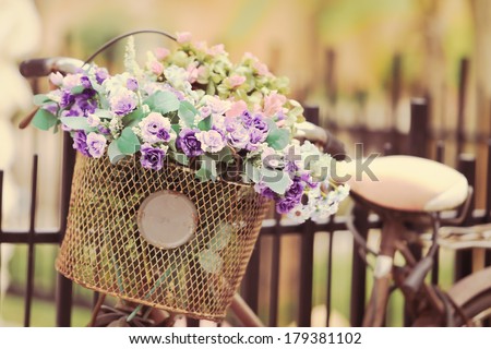 The bike basket with roses with retro filter effect