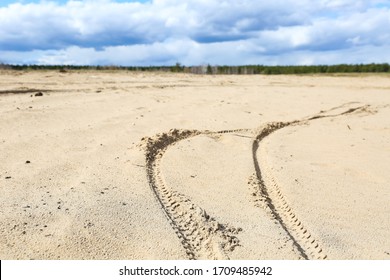 Bike Or Bicycle Tracks In The Sand