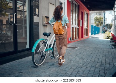 Bike, City And Back View Of Black Woman, Walking On Street Or Urban Road Outdoors. Exercise, Fitness And Female Student On Bicycle Ride, Eco Friendly Transportation And Cycling On Asphalt In Town.