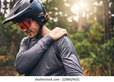 Bike Cyclist, Fitness And Injury In Nature Forest, Environment Or Australian Woods After Exercise, Training And Workout. Shoulder Pain, Medical Emergency And Healthcare For Sports Man After Accident