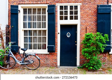 Bike In Front Of A Brick Facade Of The Old Dutch House