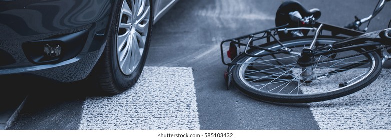 A Bike Lying On A Street Next To A Car After Accident, Panorama