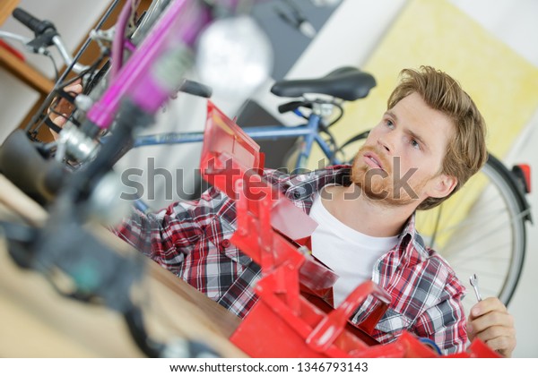 bike mechanic with auto\
repair tools