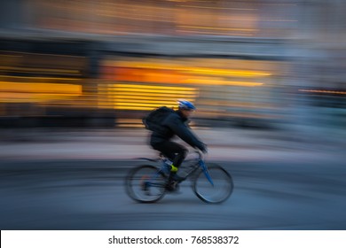 Bike Messenger Courier Delivering In City With Motion Blur