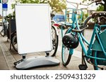 Bike, mockup and sign at rental station for commute, tourism or safe public transportation in city. Bicycle, poster and space with retail service for holiday, travel or vacation in urban town