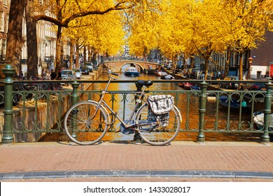 Bike On A Bridge, Canal Ring Of Amsterdam, Netherlands At Fall