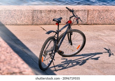 The Bike Is On The Embankment, There Are No People.