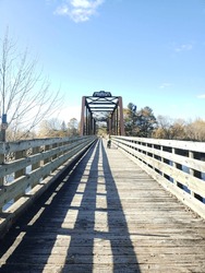 A Bike On A Wooden Trail Passing A Bridge In Pontiac - Quebec - Canada